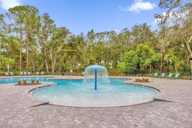 715 Chinoy Rd, Davenport, FL 33837 - pool featuring a patio area and fence