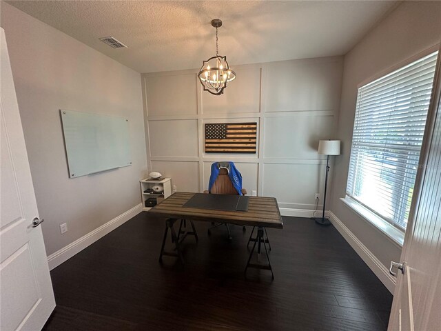 3399 Buoy Cir, Winter Garden, FL 34787 - dining area featuring dark wood-style flooring, a textured ceiling, a decorative wall, visible vents, and an inviting chandelier