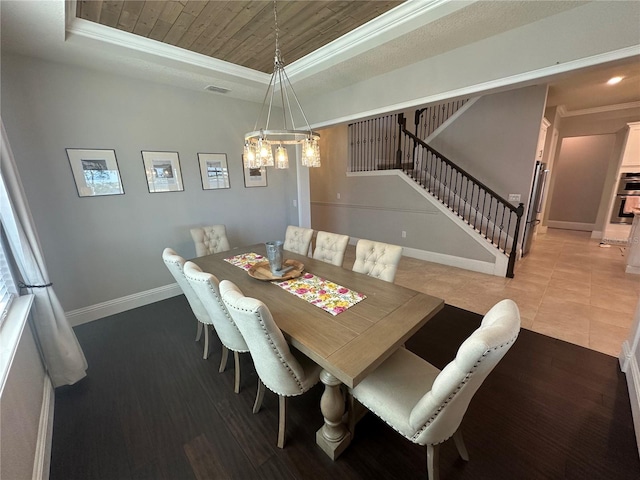 3399 Buoy Cir, Winter Garden, FL 34787 - dining area featuring a tray ceiling, crown molding, wood ceiling, stairway, and baseboards