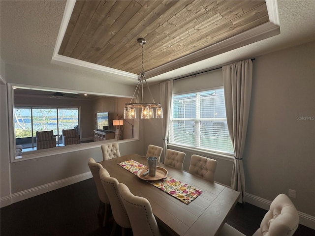 3399 Buoy Cir, Winter Garden, FL 34787 - dining room featuring a raised ceiling, wooden ceiling, and a chandelier