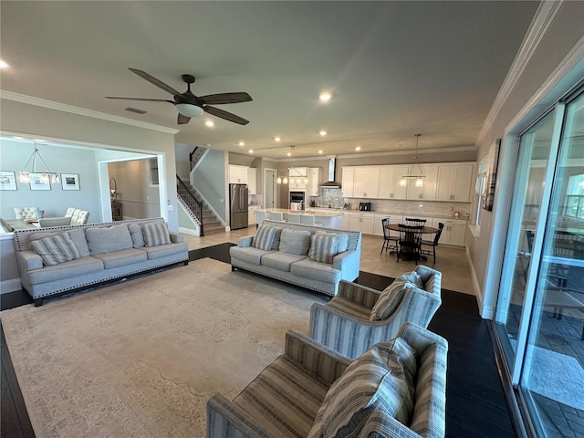 3399 Buoy Cir, Winter Garden, FL 34787 - living area featuring crown molding, stairway, visible vents, ceiling fan, and recessed lighting