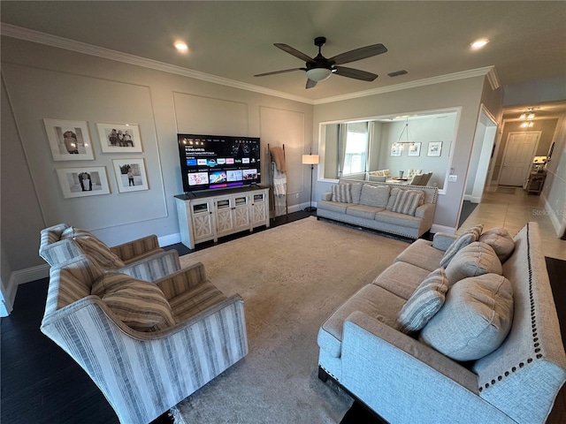 3399 Buoy Cir, Winter Garden, FL 34787 - living room featuring ornamental molding, baseboards, ceiling fan, and visible vents