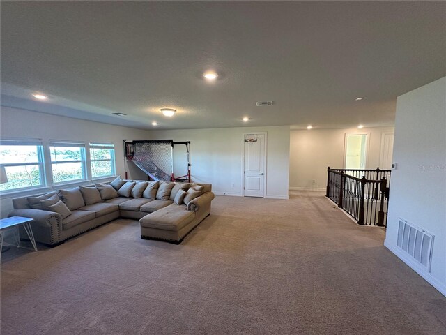 3399 Buoy Cir, Winter Garden, FL 34787 - living area featuring light carpet, baseboards, visible vents, and recessed lighting
