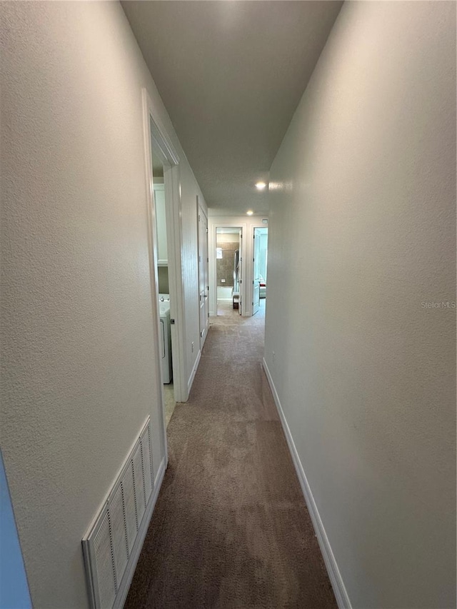 3399 Buoy Cir, Winter Garden, FL 34787 - hallway featuring baseboards, visible vents, washer / dryer, and carpet