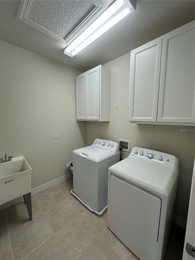 3399 Buoy Cir, Winter Garden, FL 34787 - washroom with baseboards, cabinet space, a textured ceiling, and independent washer and dryer