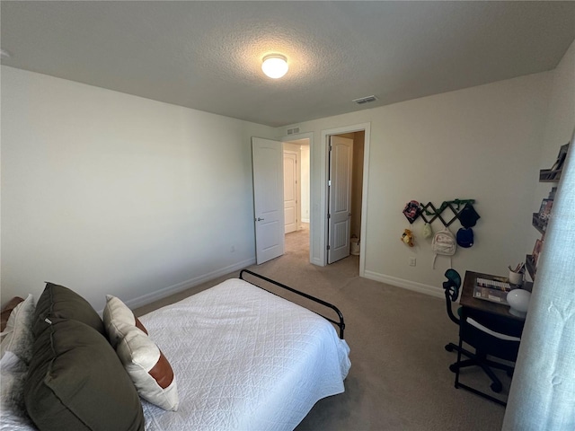 3399 Buoy Cir, Winter Garden, FL 34787 - bedroom with light carpet, a textured ceiling, baseboards, and visible vents