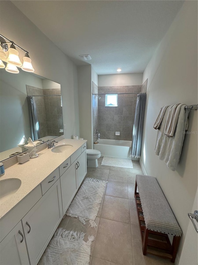 3399 Buoy Cir, Winter Garden, FL 34787 - bathroom featuring tile patterned floors, toilet, shower / tub combo with curtain, and a sink