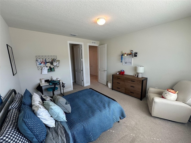 3399 Buoy Cir, Winter Garden, FL 34787 - bedroom with a textured ceiling, baseboards, light colored carpet, and visible vents