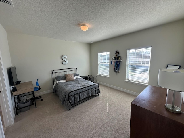 3399 Buoy Cir, Winter Garden, FL 34787 - bedroom featuring baseboards, carpet flooring, a textured ceiling, and visible vents