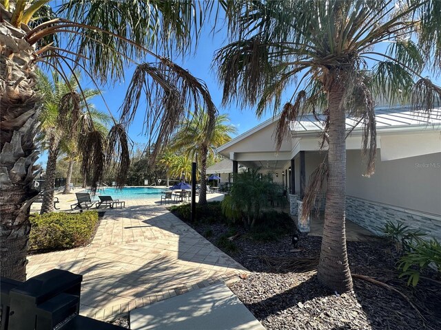 3399 Buoy Cir, Winter Garden, FL 34787 - view of yard with a community pool and a patio area