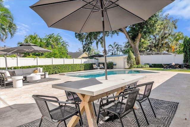 5205 Saint Regis Pl, Belle Isle, FL 32812 - view of swimming pool with a fenced in pool, a patio, an outdoor living space, a fenced backyard, and an outbuilding