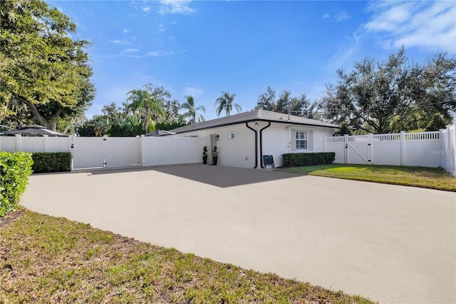 5205 Saint Regis Pl, Belle Isle, FL 32812 - exterior space with fence, a patio area, and a gate