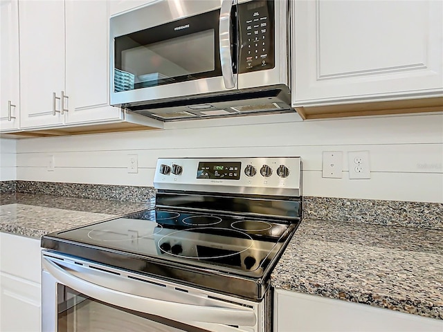 9432 Komika Ln, Winter Garden, FL 34787 - kitchen with white cabinetry and appliances with stainless steel finishes