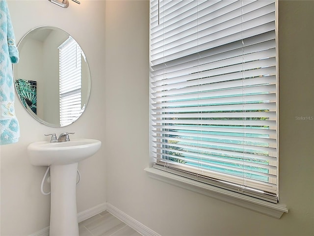 9432 Komika Ln, Winter Garden, FL 34787 - bathroom featuring baseboards