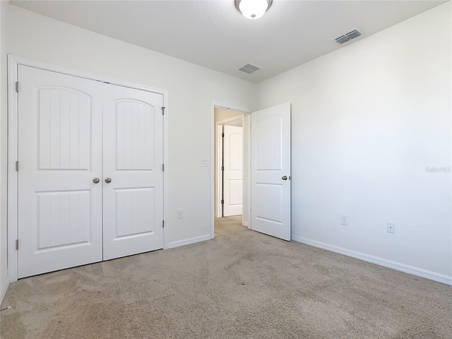 9432 Komika Ln, Winter Garden, FL 34787 - unfurnished bedroom with carpet floors, baseboards, visible vents, and a closet