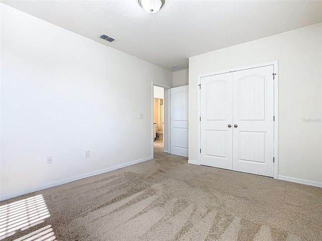 9432 Komika Ln, Winter Garden, FL 34787 - unfurnished bedroom with a closet, visible vents, baseboards, and carpet floors