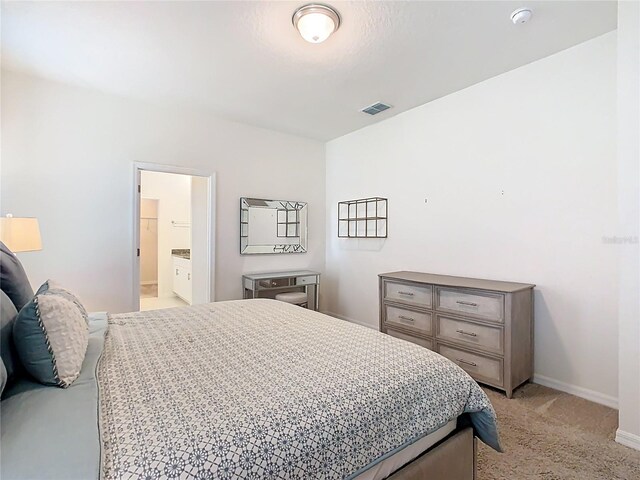 9432 Komika Ln, Winter Garden, FL 34787 - bedroom with visible vents, baseboards, and light carpet