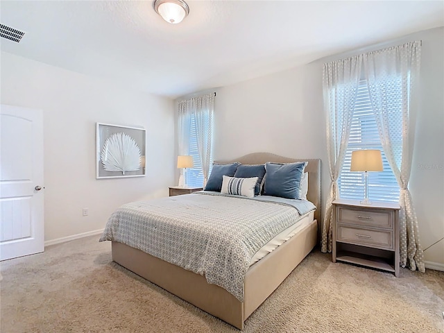 9432 Komika Ln, Winter Garden, FL 34787 - bedroom featuring visible vents, baseboards, and light carpet