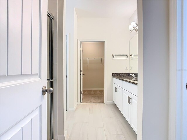 9432 Komika Ln, Winter Garden, FL 34787 - bathroom featuring vanity and a spacious closet
