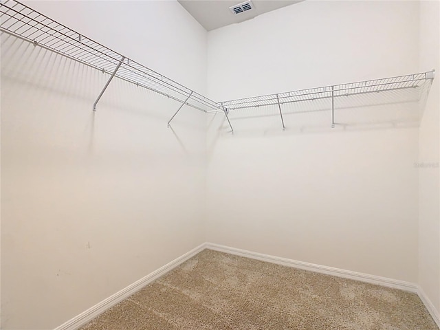 9432 Komika Ln, Winter Garden, FL 34787 - walk in closet featuring light carpet and visible vents