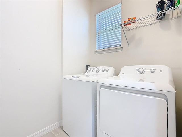 9432 Komika Ln, Winter Garden, FL 34787 - washroom featuring laundry area, baseboards, and separate washer and dryer
