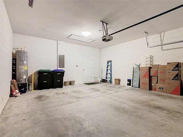 9432 Komika Ln, Winter Garden, FL 34787 - garage featuring concrete block wall, electric panel, electric water heater, and a garage door opener