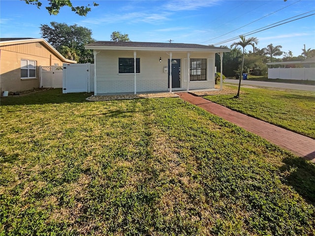 701 71st Ave N, Saint Petersburg, FL 33702 - view of front of home featuring a gate and brick siding