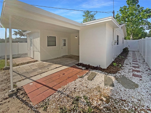 701 71st Ave N, Saint Petersburg, FL 33702 - doorway to property with a patio area