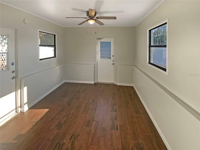 701 71st Ave N, Saint Petersburg, FL 33702 - unfurnished room with crown molding, wood finished floors, healthy amount of natural light, a ceiling fan, and baseboards