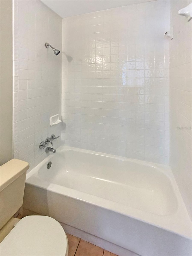 701 71st Ave N, Saint Petersburg, FL 33702 - full bath featuring toilet, tile patterned flooring, and tub / shower combination