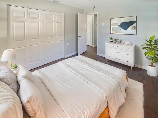 701 71st Ave N, Saint Petersburg, FL 33702 - bedroom featuring baseboards, wood finished floors, and a closet