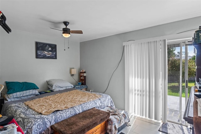 tiled bedroom featuring a ceiling fan and access to exterior
