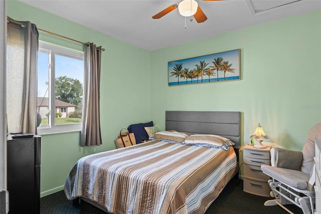 bedroom with baseboards, carpet floors, and a ceiling fan