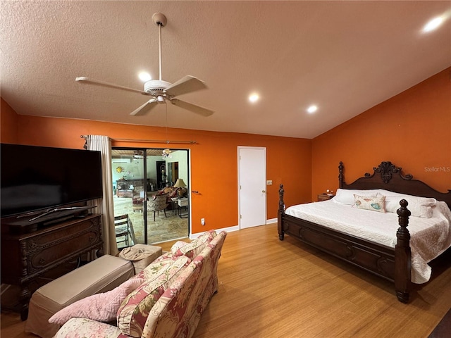 913 Red Fox Rd, Altamonte Springs, FL 32714 - bedroom with light wood-style flooring, access to outside, baseboards, ceiling fan, and a textured ceiling
