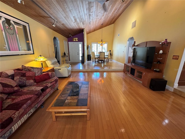 913 Red Fox Rd, Altamonte Springs, FL 32714 - living area with vaulted ceiling, wood ceiling, a chandelier, hardwood / wood-style flooring, and baseboards