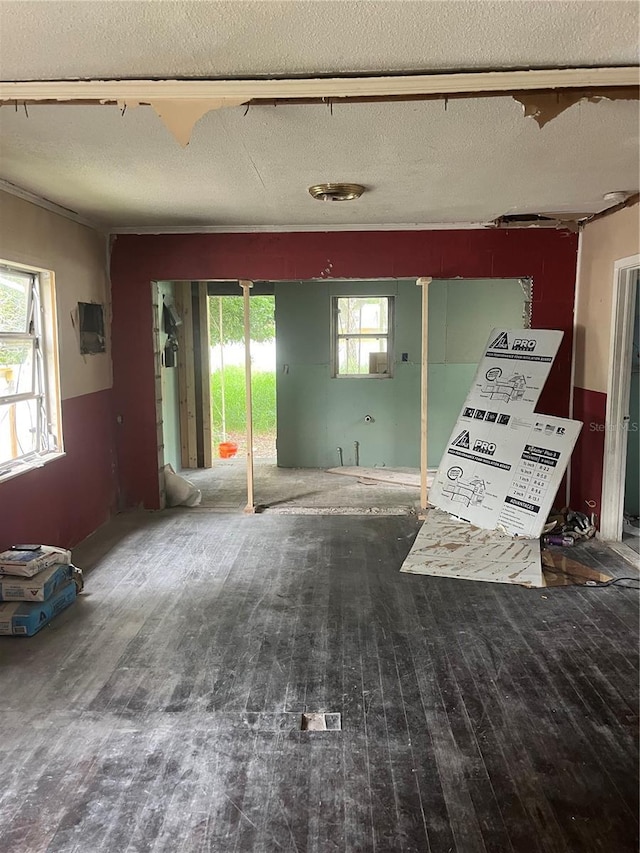 1905 S Westmoreland Dr, Orlando, FL 32805 - unfurnished living room with hardwood / wood-style flooring and a textured ceiling