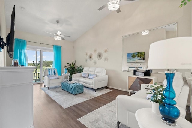 2808 Osprey Cove Pl Unit 201, Kissimmee, FL 34746 - living room with a ceiling fan, wood finished floors, high vaulted ceiling, and baseboards