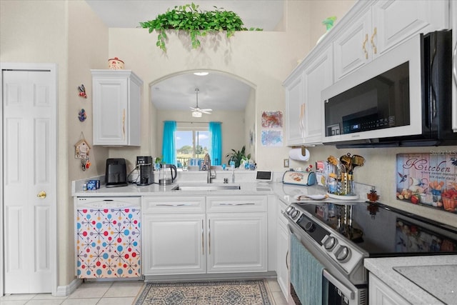 2808 Osprey Cove Pl Unit 201, Kissimmee, FL 34746 - kitchen featuring white appliances, a sink, light countertops, and white cabinets