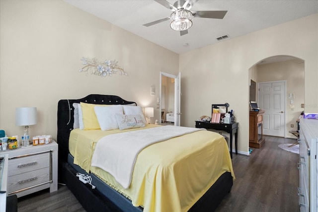 2808 Osprey Cove Pl Unit 201, Kissimmee, FL 34746 - bedroom featuring arched walkways, dark wood finished floors, and a ceiling fan