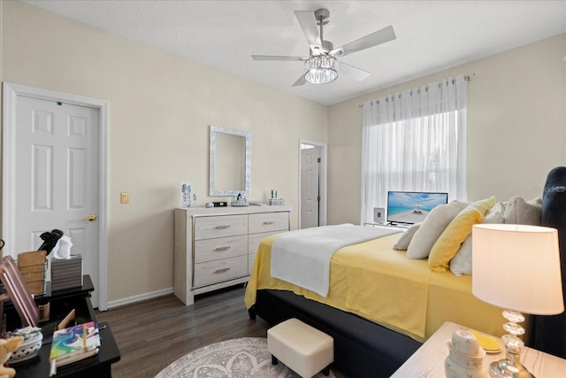 2808 Osprey Cove Pl Unit 201, Kissimmee, FL 34746 - bedroom featuring dark wood-style floors, baseboards, and ceiling fan