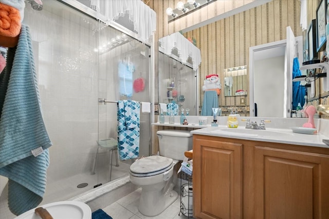 2808 Osprey Cove Pl Unit 201, Kissimmee, FL 34746 - full bath featuring toilet, a shower stall, tile patterned floors, vanity, and wallpapered walls