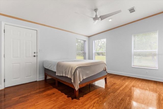 10809 Cedar Cove Dr, Thonotosassa, FL 33592 - bedroom with baseboards, light wood-type flooring, crown molding, visible vents, and lofted ceiling