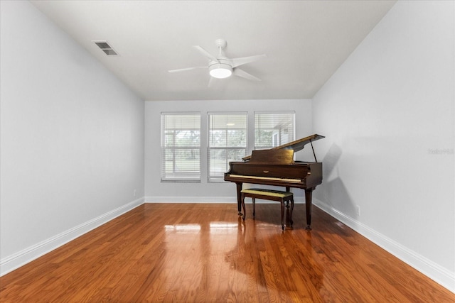 10809 Cedar Cove Dr, Thonotosassa, FL 33592 - living area with wood finished floors, ceiling fan, baseboards, and visible vents