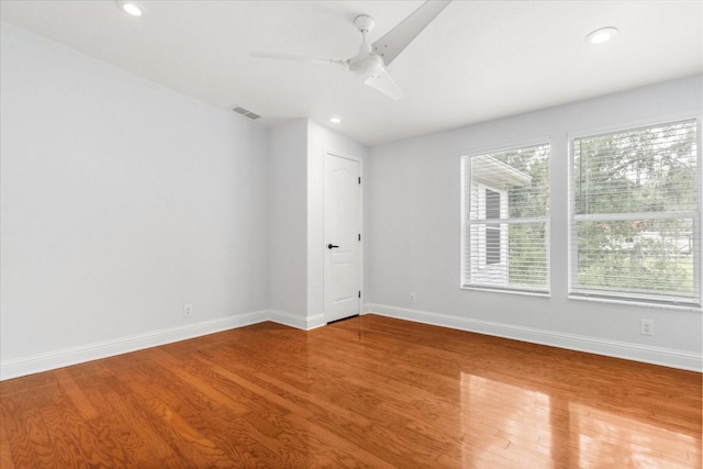 10809 Cedar Cove Dr, Thonotosassa, FL 33592 - unfurnished room featuring wood finished floors, baseboards, a ceiling fan, and visible vents