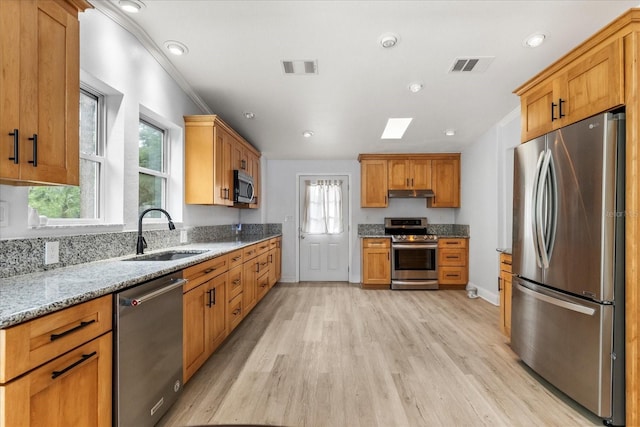 10809 Cedar Cove Dr, Thonotosassa, FL 33592 - kitchen featuring visible vents, a sink, appliances with stainless steel finishes, under cabinet range hood, and light stone counters