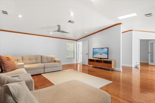 10809 Cedar Cove Dr, Thonotosassa, FL 33592 - living room with crown molding, wood finished floors, and visible vents