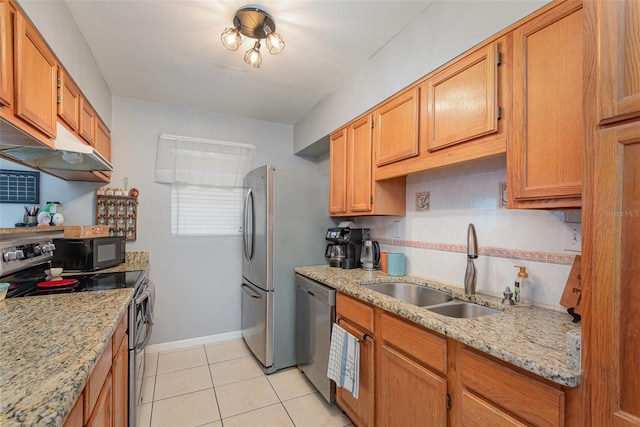 4520 Browning Ave, Titusville, FL 32780 - kitchen with light tile patterned floors, baseboards, a sink, stainless steel appliances, and decorative backsplash