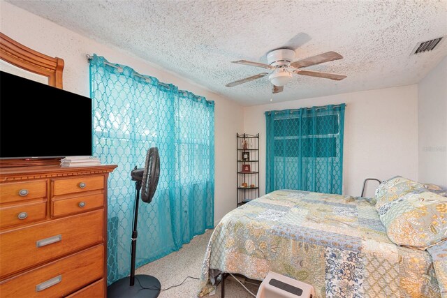 4520 Browning Ave, Titusville, FL 32780 - bedroom with visible vents, a ceiling fan, and a textured ceiling