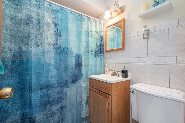 4520 Browning Ave, Titusville, FL 32780 - bathroom with toilet, vanity, a shower with curtain, and tile walls
