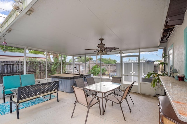 4520 Browning Ave, Titusville, FL 32780 - sunroom with outdoor dining space, a ceiling fan, and a hot tub
